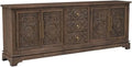 Pemberly Row Solid Mango Wood Sideboard, 39' H x 106' W x 17' D, Brown Finish, 3-Drawer 4-Door Design, Decorative Floral Carvings, Metal Handles, Spacious Cabinets, Dining Room or Living Room Storage