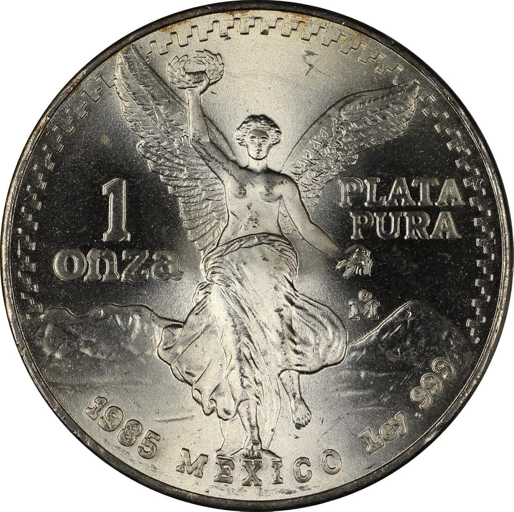 1982 - 1995 Mexico 1 Troy Oz .999 Fine Silver Libertad Silver Coin I Features the National Seal of Mexico 'Estados Unidos Mexicanos' Winged Victory Statue With Volcanoes Popocatépetl and Iztaccíhuatl I Monetized By Mexican Government
